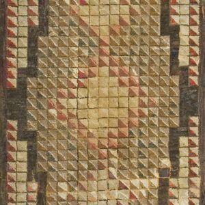 Textured, geometric rug featuring raised pyramid squares and a dark stepped border in tan, red, and brown tones.