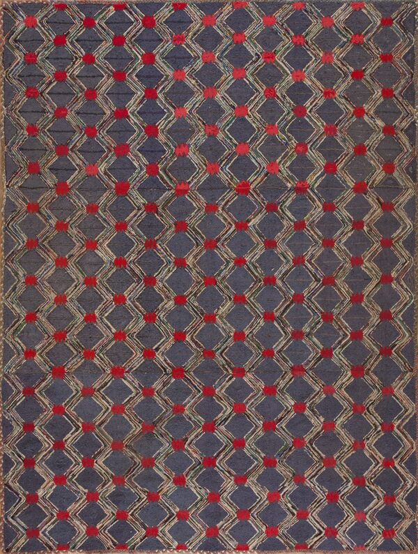 Slate blue rug features a textured, multicolored diamond trellis pattern with bright red dots at the intersections.