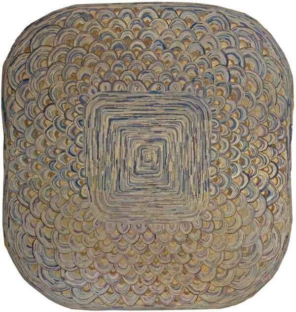 Highly textured rounded square rug featuring a central striped square and layered blue and beige scale patterns.