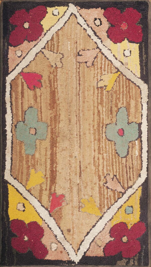 Rustic hooked rug with a central beige diamond pattern bordered by stylized maroon and yellow flowers.