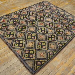 Textured, diamond-shaped rug with a checkerboard pattern of floral and geometric squares on light wood flooring.