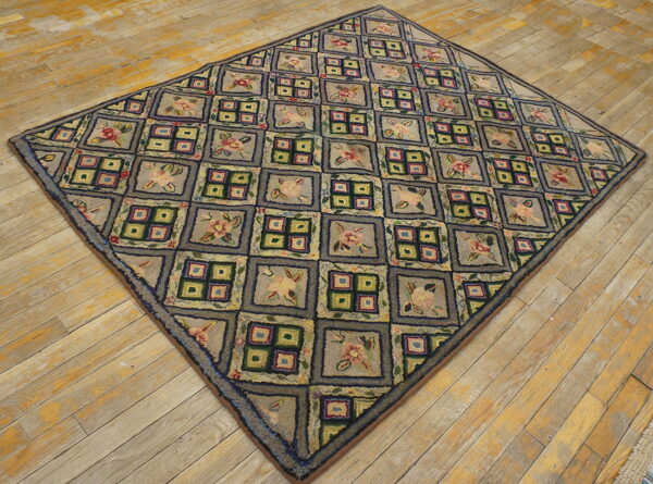 Textured, diamond-shaped rug with a checkerboard pattern of floral and geometric squares on light wood flooring.
