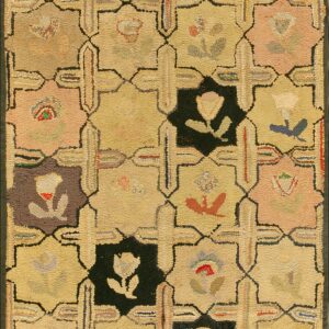 Low-pile rug with a yellow and multicolor lattice pattern featuring floral motifs in dark squares.