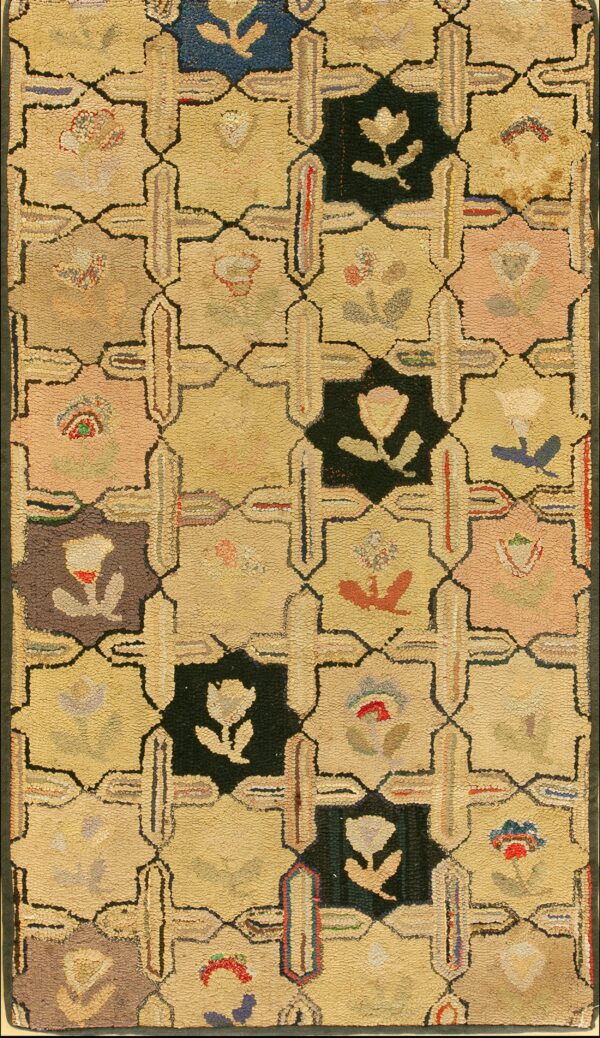 Low-pile rug with a yellow and multicolor lattice pattern featuring floral motifs in dark squares.
