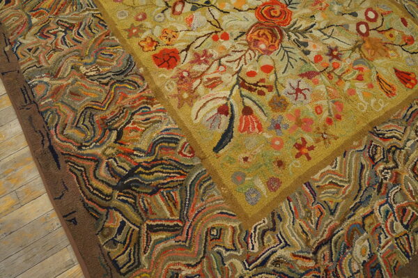 Multicolored high-pile rug detail showing a floral center framed by abstract, striped patterns on wood.