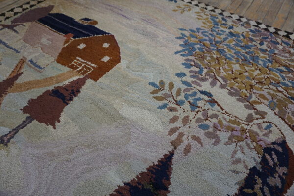 Textured high-pile rug featuring a pictorial design of a brown cabin and trees on rustic wood flooring.
