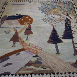 High-pile rug featuring a pictorial landscape of a house and trees, lying on rustic wood planks.