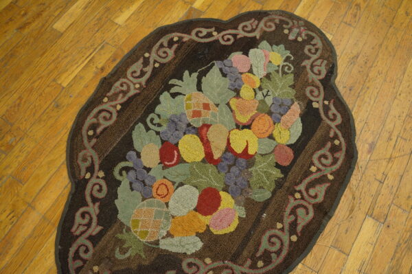 Colorful fruit design on dark rug