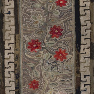 Hooked rug runner featuring red flowers and green leaves on a mottled brown field with a light beige Greek Key border.