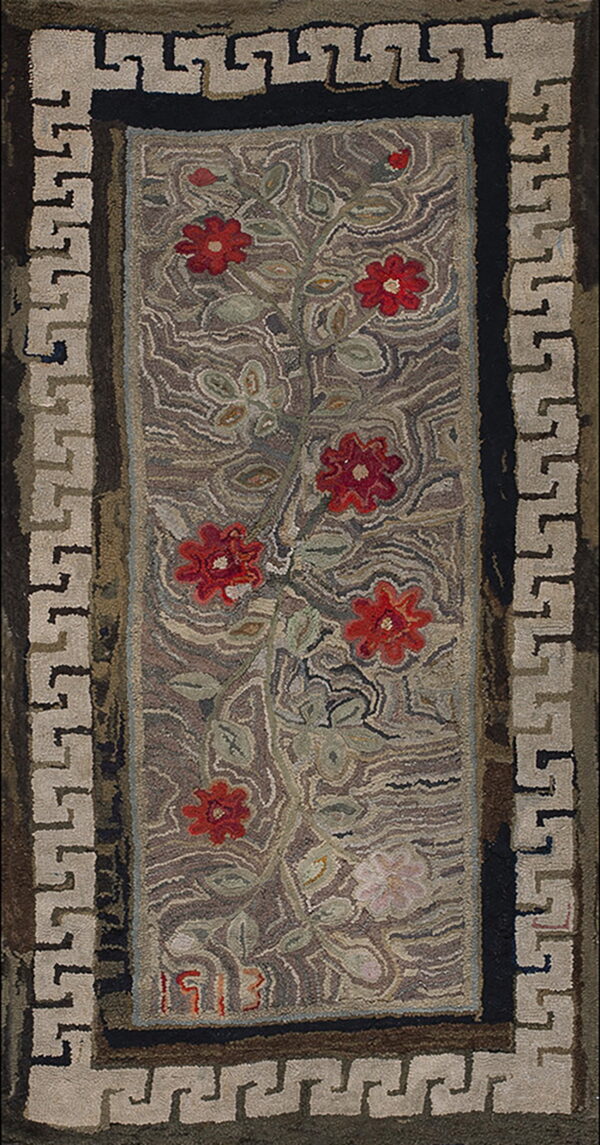 Hooked rug runner featuring red flowers and green leaves on a mottled brown field with a light beige greek key border.
