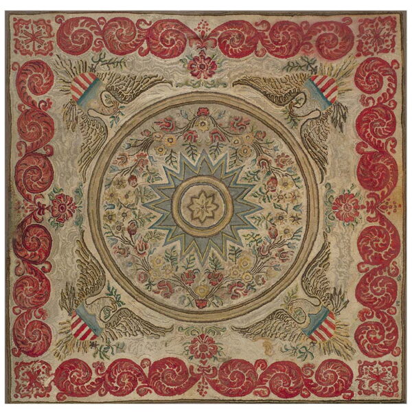 Square hooked rug featuring a central star and floral medallion, framed by red scrolling patterns and eagles.