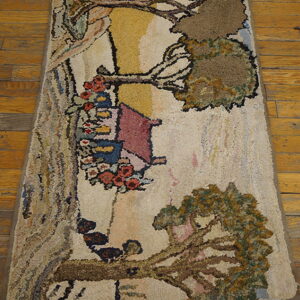 High-pile rug featuring a rustic landscape of trees, red flowers, and a pink house on wooden flooring.