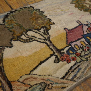 Textured rug with a pictorial scene of trees and a pink-roofed cottage on distressed yellow wood planks.