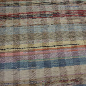 Muted multicolored flat-weave rug with horizontal stripes and a patchwork checkerboard texture.
