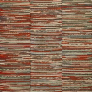 A textured, flat-woven rug with vertical multicolored stripes of red, blue, gray, and brown strips on wood.