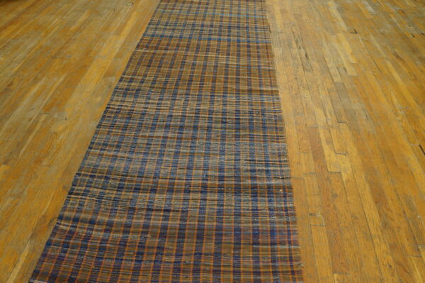 Vintage american rag rug hallway runner multicolor 1950s 7 Flatweave hallway runner with a blue, brown, and orange checked pattern on wide plank hardwood flooring.