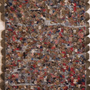 Highly textured rag rug with multicolored scraps and a contrasting dark scalloped edge displayed vertically.