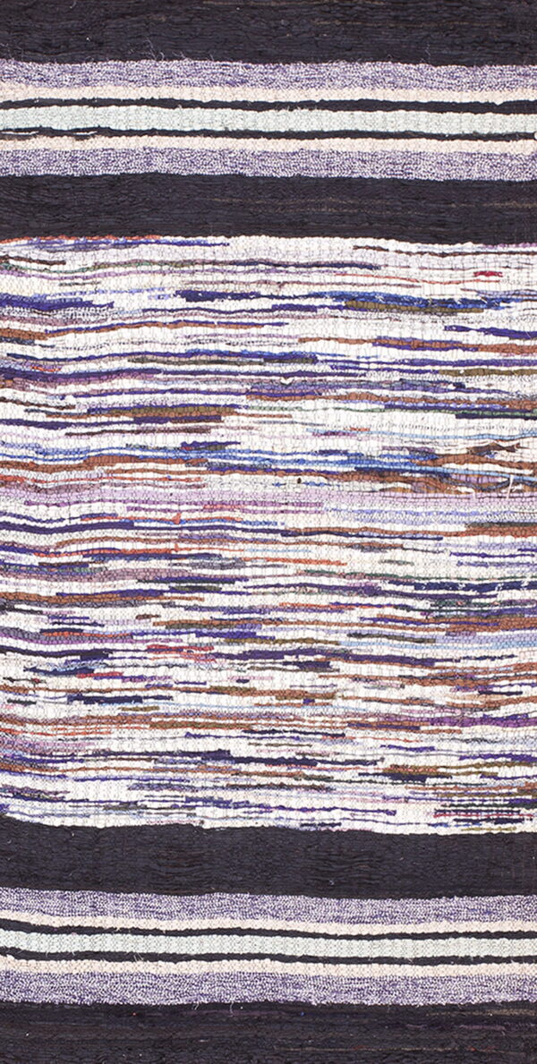 Woven rug texture showing alternating dark black bands and variegated stripes of purple, white, and brown.