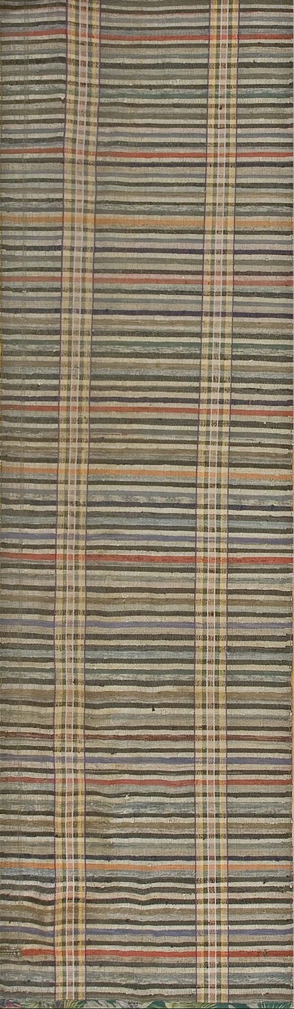 Flatwoven rug with muted horizontal stripes of green, gray, and red intersected by plaid columns.