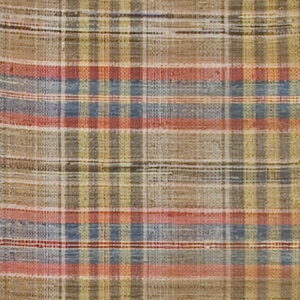 Tan flatweave rug showing a rustic plaid pattern with thin stripes of red, blue, and gold.