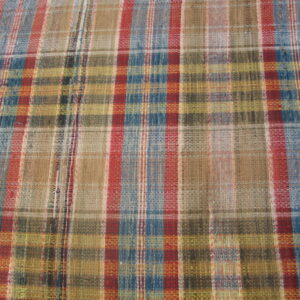 Flatwoven rug with a traditional plaid pattern using red, blue, tan, and olive colors.