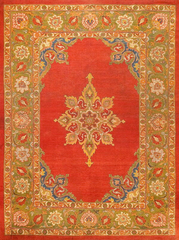 Low-pile rug with a vibrant red field, a central star medallion, and detailed green and orange floral borders.