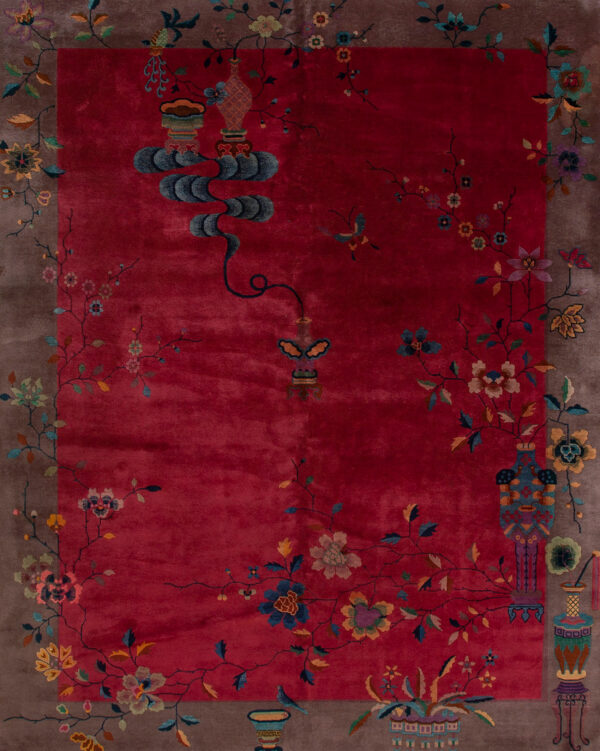 Vibrant red rug with floral patterns.