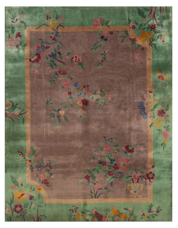 Muted brown center rug with a wide green border and colorful scrolling floral vine pattern.