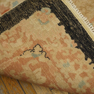 Vintage rug with intricate floral patterns.