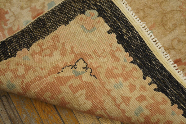 Vintage rug with intricate floral patterns.