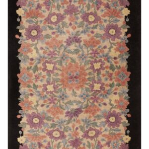 Rectangular rug with a dense pattern of purple, coral, and blue flowers on tan, framed by a solid black border.