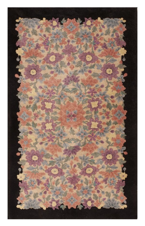 Rectangular rug with a dense pattern of purple, coral, and blue flowers on tan, framed by a solid black border.