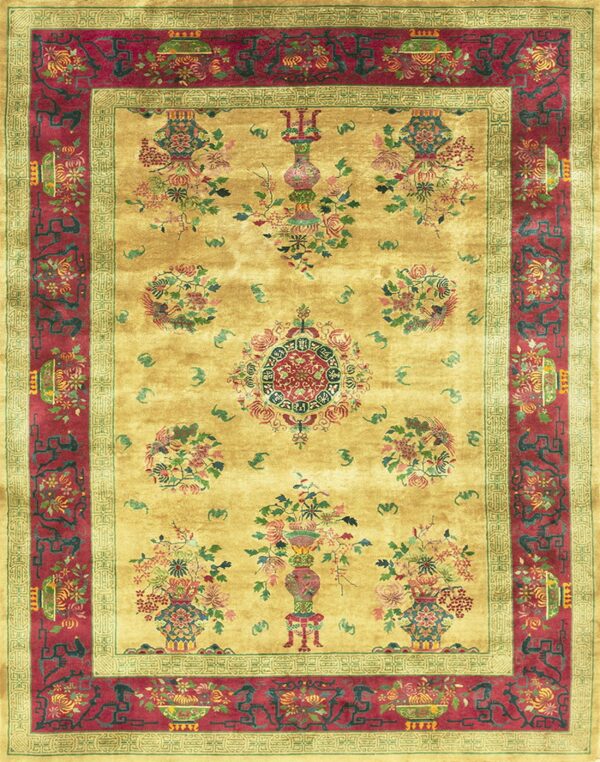 Ornate gold rug featuring floral vases and medallions, framed by a wide magenta and green border.