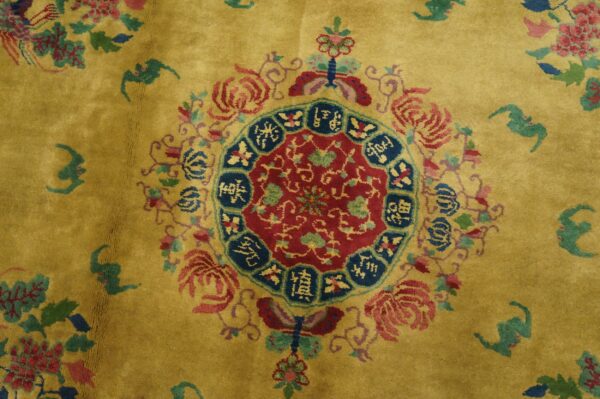 Yellow-gold high-pile rug featuring a vibrant red and blue medallion with surrounding multicolor floral elements.