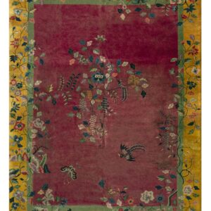 Magenta and golden-yellow rug featuring a detailed border of flowering vines, grapes, birds, and butterflies.