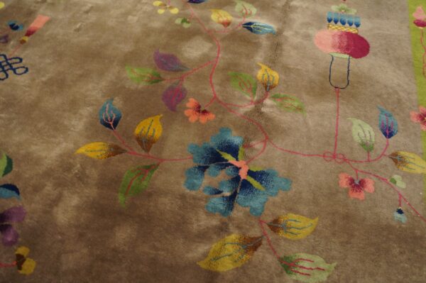 Plush taupe rug displaying colorful stylized floral and vine motifs in blue, yellow, green, and magenta.