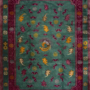 Plush teal rug with magenta borders, intricate scrollwork, and a central golden phoenix motif.