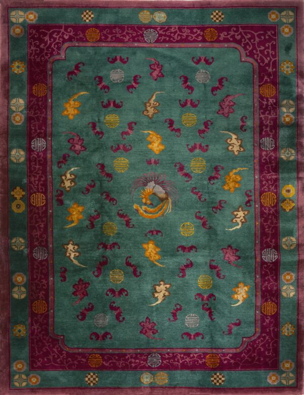 Plush teal rug with magenta borders, intricate scrollwork, and a central golden phoenix motif.