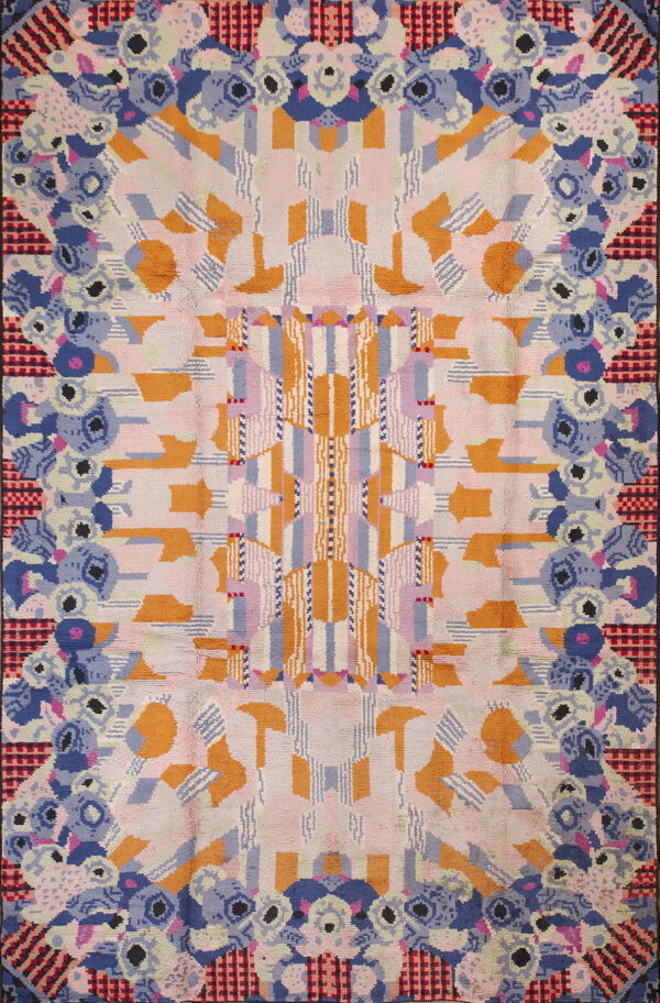 Abstract rug displaying central geometric stripes flanked by dense floral motifs in blue, pink, and orange.