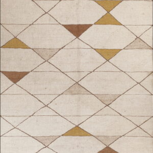 Low pile rug with an off-white diamond lattice pattern containing varied brown and gold triangles.