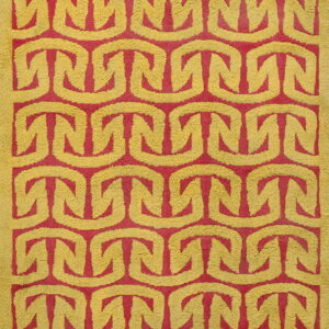 The high-pile rug features a repeating interlocking chain design in bright yellow and vibrant magenta.