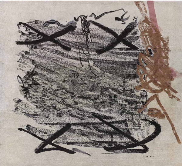 A cream rug featuring an abstract, scribbled pattern in black, brown, and pink.