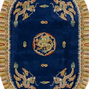 Deep blue oval rug with an ornate dragon motif surrounded by a striped border in earth tones.