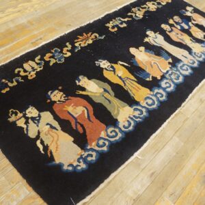 Dark runner rug depicting a procession of eight figures in colorful robes floating over blue clouds.