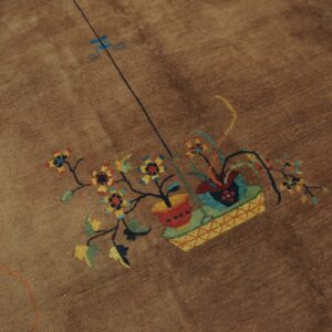 Brown textured rug featuring a detailed colorful bouquet in a basket motif.