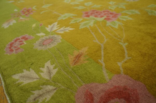 A high-pile rug features large pink and taupe florals against bright green and gold color block fields.