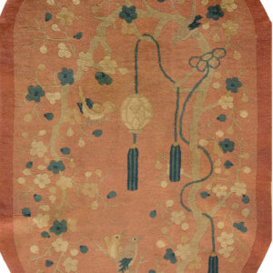 Floral design on salmon background rug.