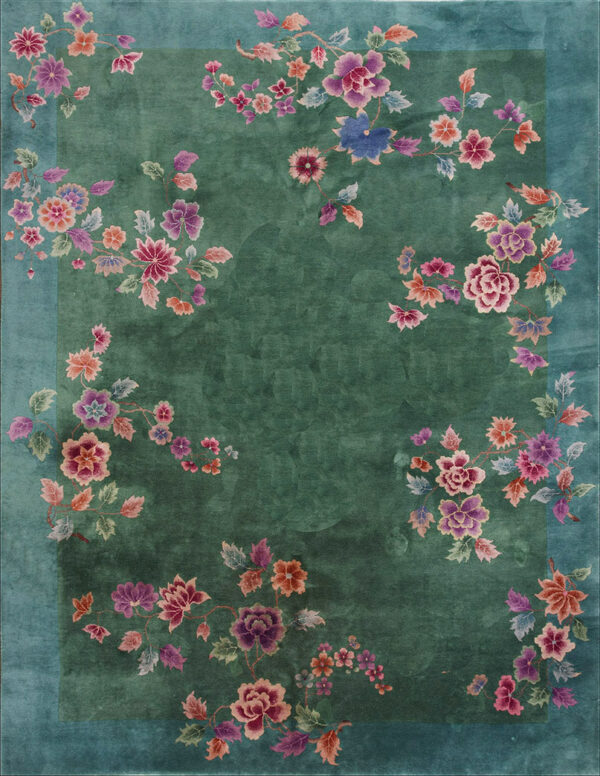 Deep jade green rug featuring winding vines of pink, purple, and coral flowers with a solid teal border.