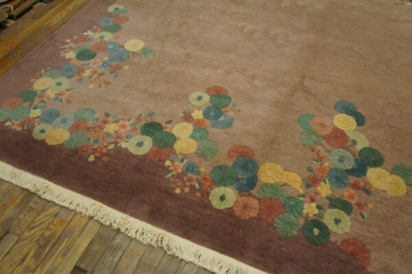 Mauve rug with scattered large circular flowers in blue, yellow, green, and rust on wood flooring.