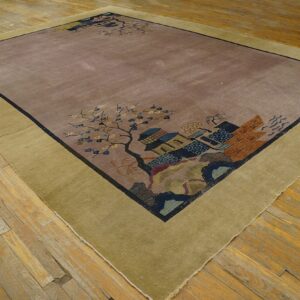 Mauve area rug with wide olive border and detailed scenic pattern rests on distressed wood planks.